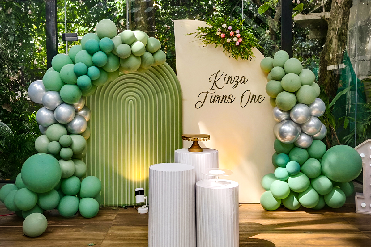 Birthday celebration with balloons and cake