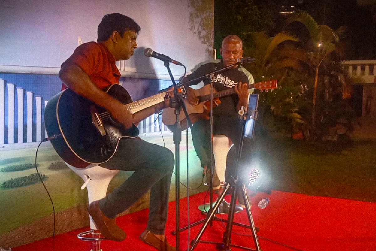 Live band performing on stage with audience cheering